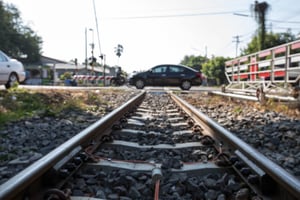 Car Crossing Railroad Tracks